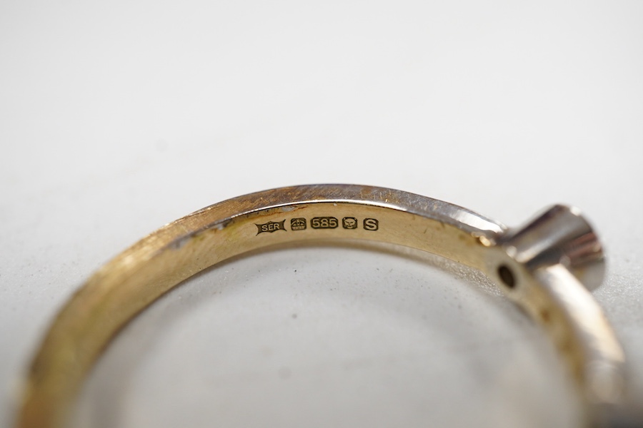 Two modern similar 14ct gold and diamond rings, one in yellow gold, with three collet set stones and six smaller stones, size P/Q, the other set in 9ct white gold, with two collet set stones and eleven smaller stones, si